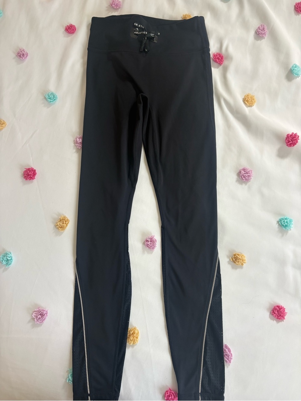 NWOT Fabletics women’s black leggings with draw string and mesh detail